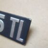 n°mc21 insigne coffre renault R5 TL alu occasion DPA86